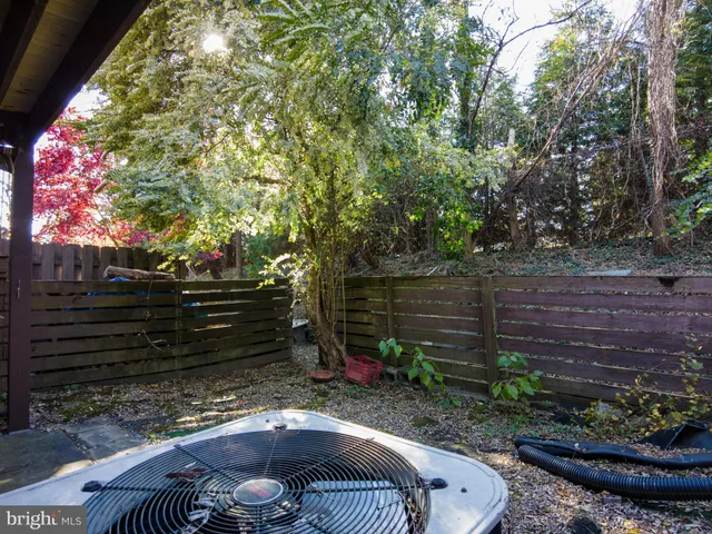 a view of a backyard with sitting area