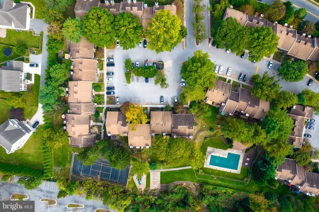 an aerial view of residential house with outdoor space and street view