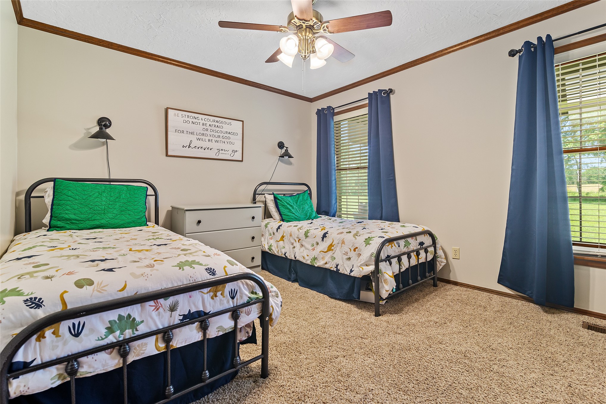 9644 19th Road Nowata, OK 74048 - Photo 17 of 36 Carpeted room featuring two windows with horizontal blinds, a ceiling fan with light fixture, and wood-finish trim
