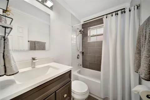 a kitchen that has a table and chairs in it