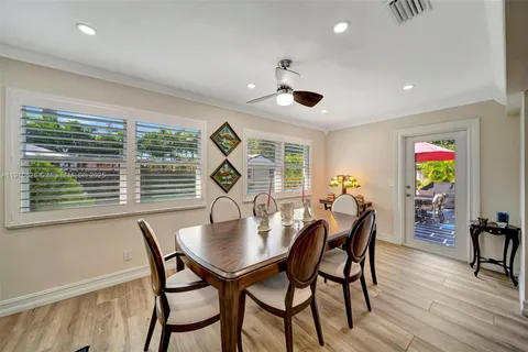 a bathroom with a sink a toilet and shower curtain