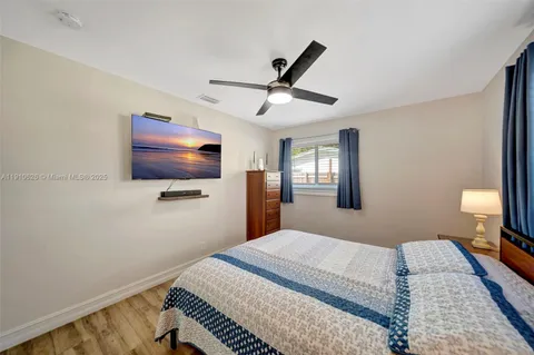 a view of backyard with outdoor seating and green space