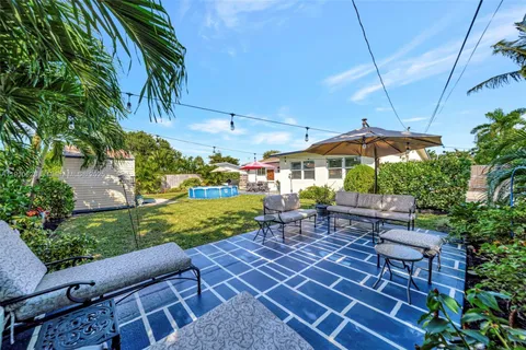 a view of a swimming pool with chairs