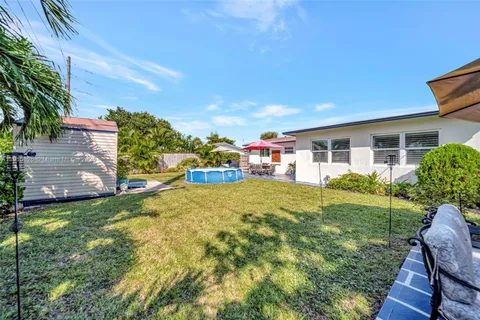 a view of a house with a yard porch and sitting area