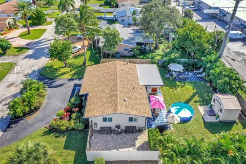 a wooden house with trees in front of it