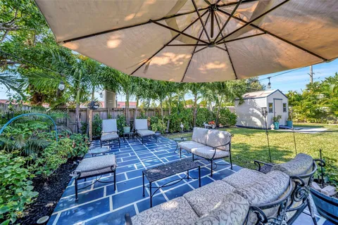a wooden bench sitting in front of a house