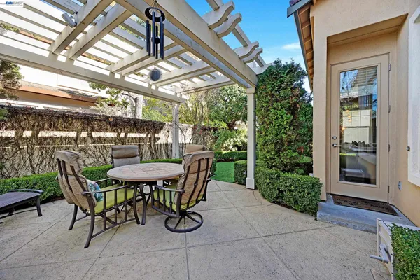 a view of a chairs and table in a patio