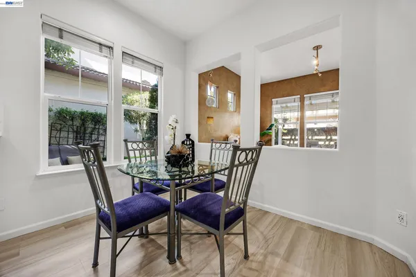 a dining room with furniture and window