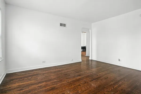 a kitchen with granite countertop white cabinets and appliances