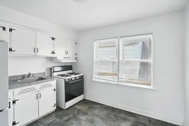 a white refrigerator freezer sitting in a kitchen