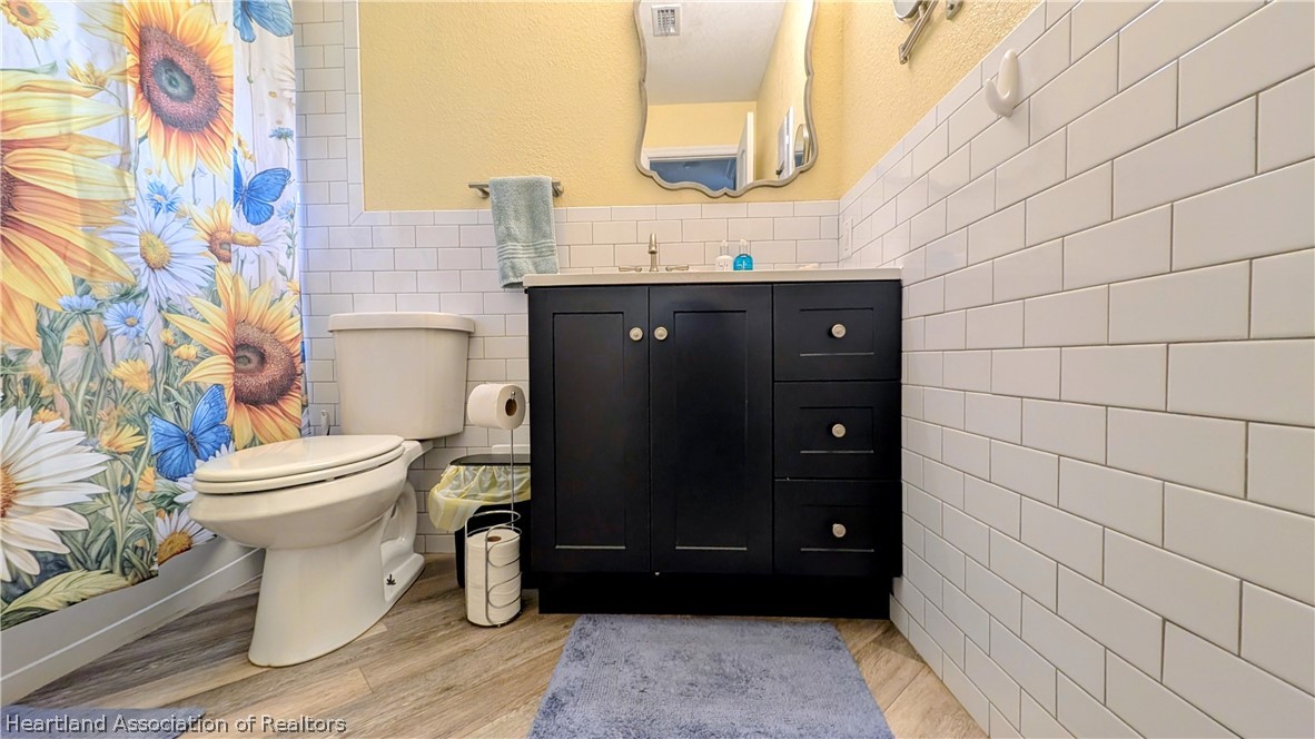 6218 Apple Road Sebring, FL 33875 - Photo 19 of 40 a bathroom with a toilet and a sink