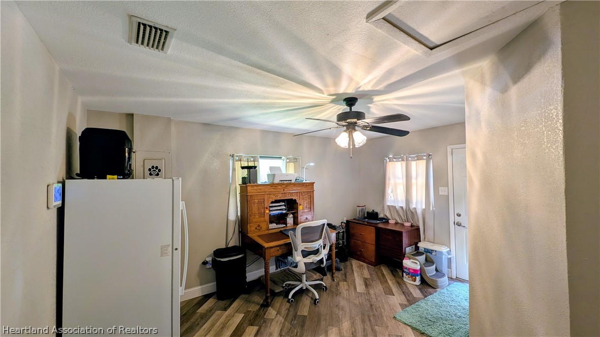 6218 Apple Road Sebring, FL 33875 - Photo 24 of 40 a view of a workspace with furniture and a window