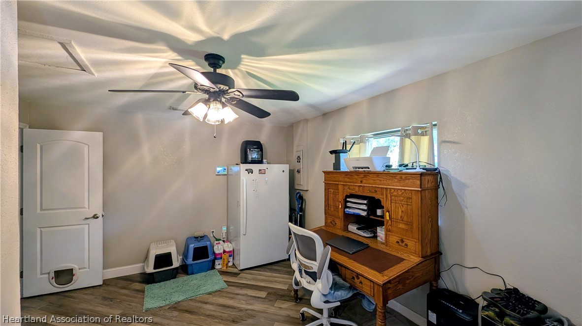 6218 Apple Road Sebring, FL 33875 - Photo 27 of 40 a living room with furniture and a fireplace
