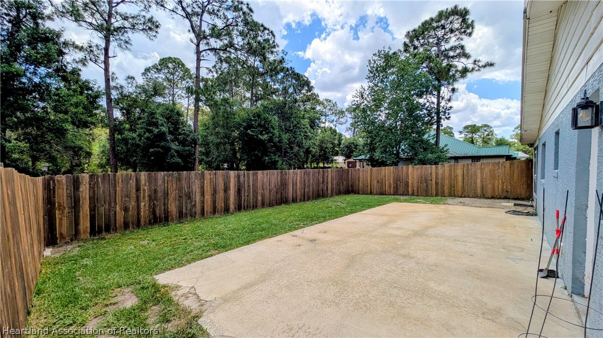 6218 Apple Road Sebring, FL 33875 - Photo 36 of 40 a view of outdoor space with wooden fence
