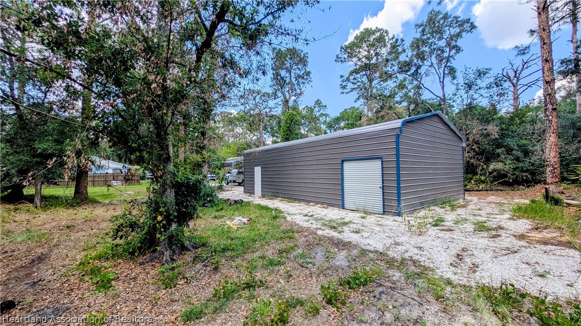 6218 Apple Road Sebring, FL 33875 - Photo 40 of 40 a backyard of a house with lots of green space