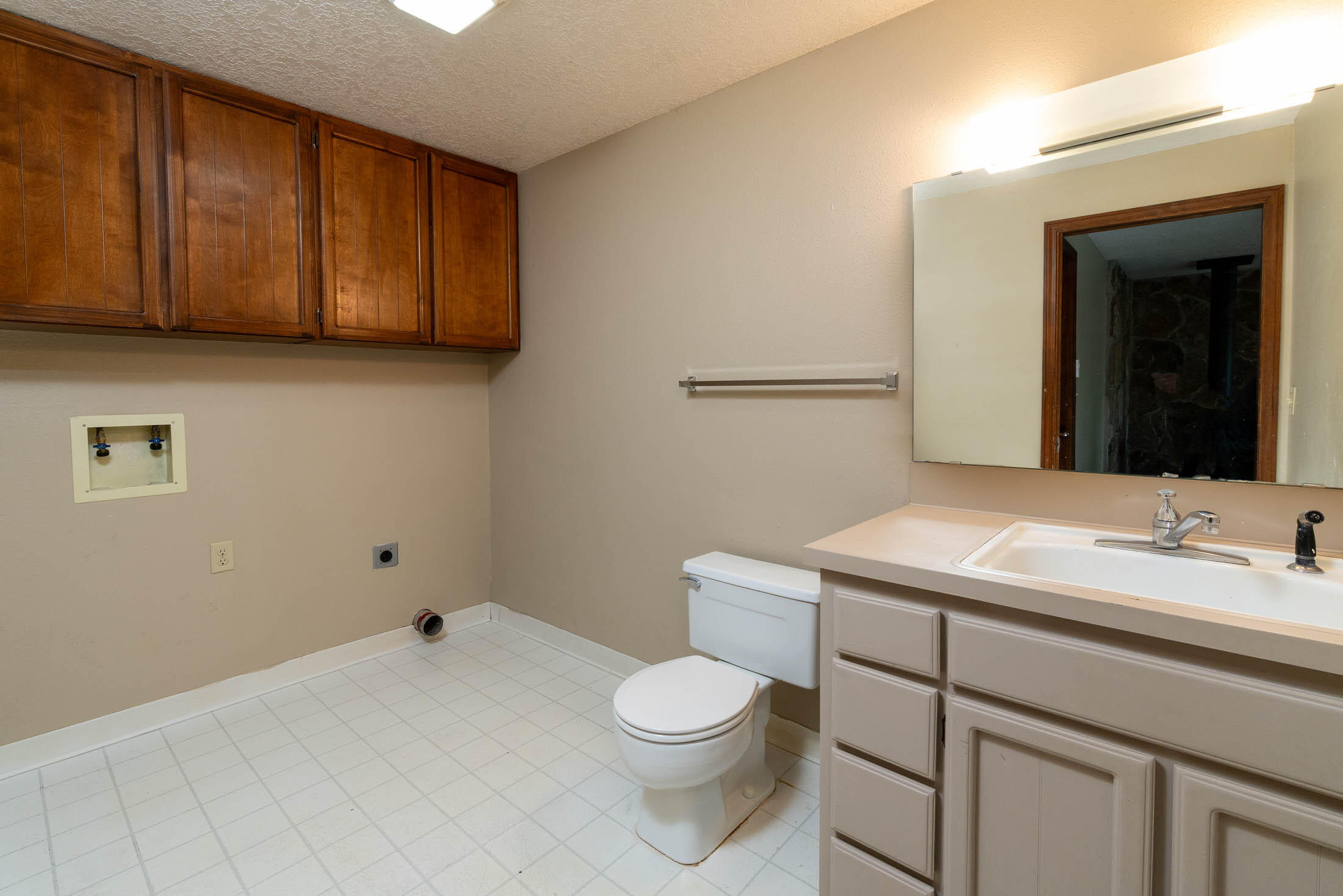 20316 Donkey Sled Road Bend, OR 97702 - Photo 11 of 50 a bathroom with a granite countertop sink a toilet and a mirror