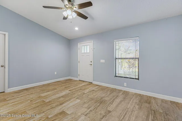 a view of an empty room with a window
