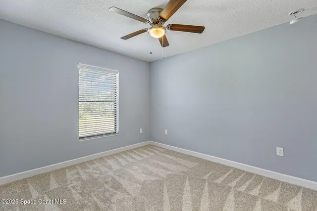 a kitchen with stainless steel appliances granite countertop a stove a microwave and a sink