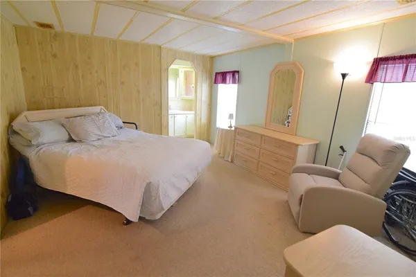 a bedroom with a bed and a couch