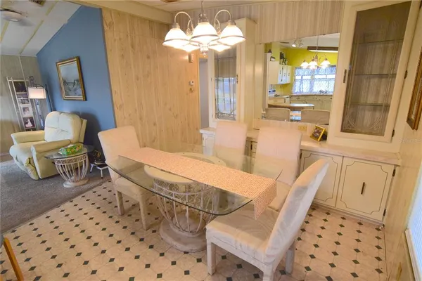 a living room with furniture a table and chairs