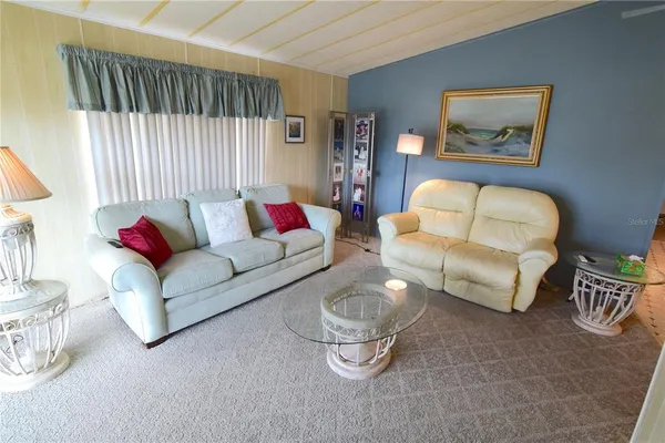 a living room with furniture and a couch
