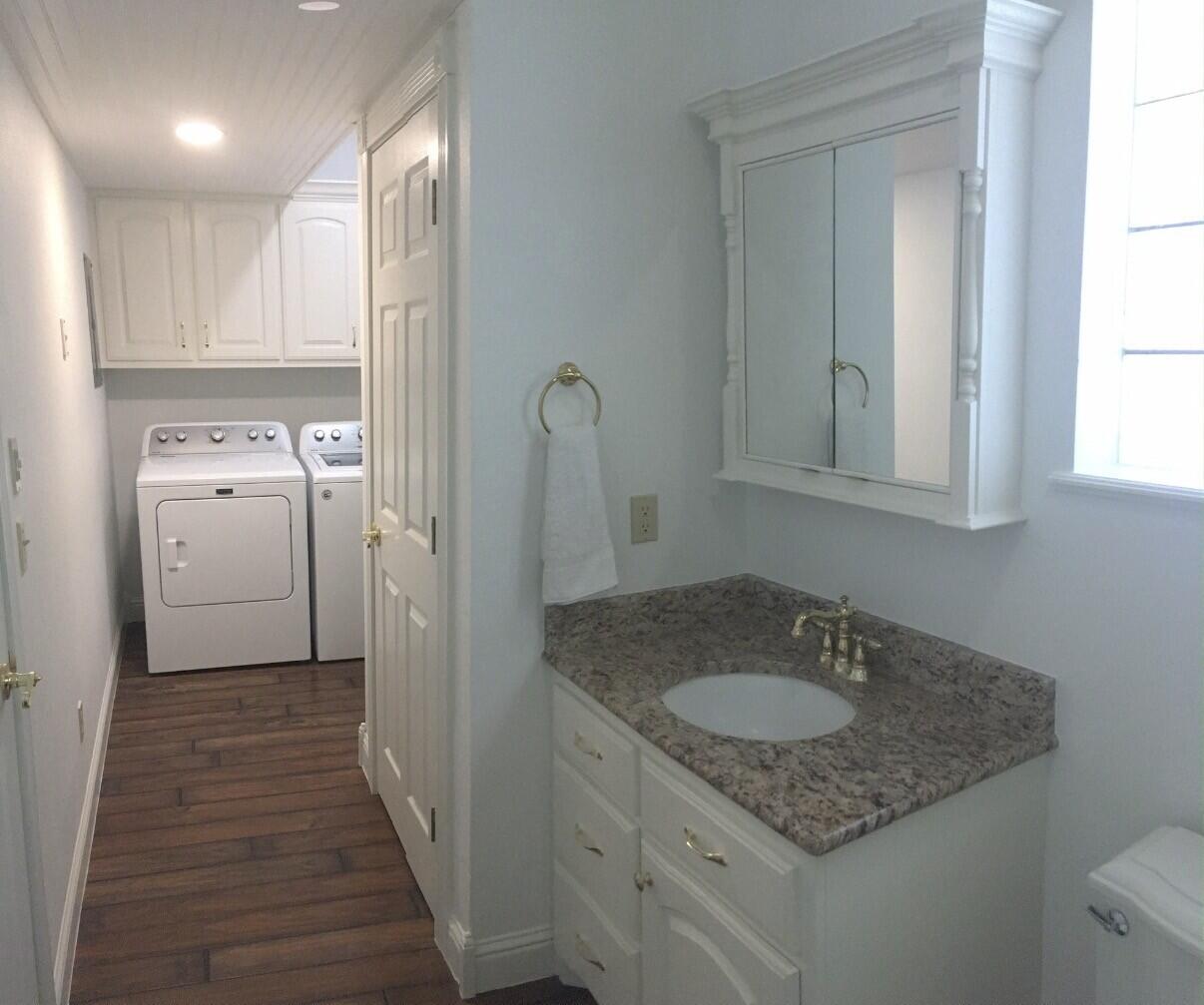 101 Southeast 6th Plainview, TX 79072 - Photo 21 of 31 a bathroom with a granite countertop sink and a mirror