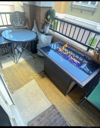 a living room with furniture and a rug