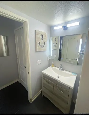 a bathroom with a sink and a mirror