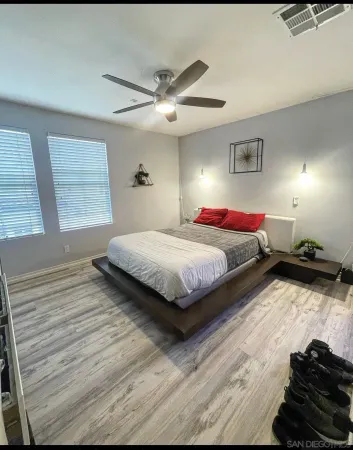 a bedroom with a bed and window