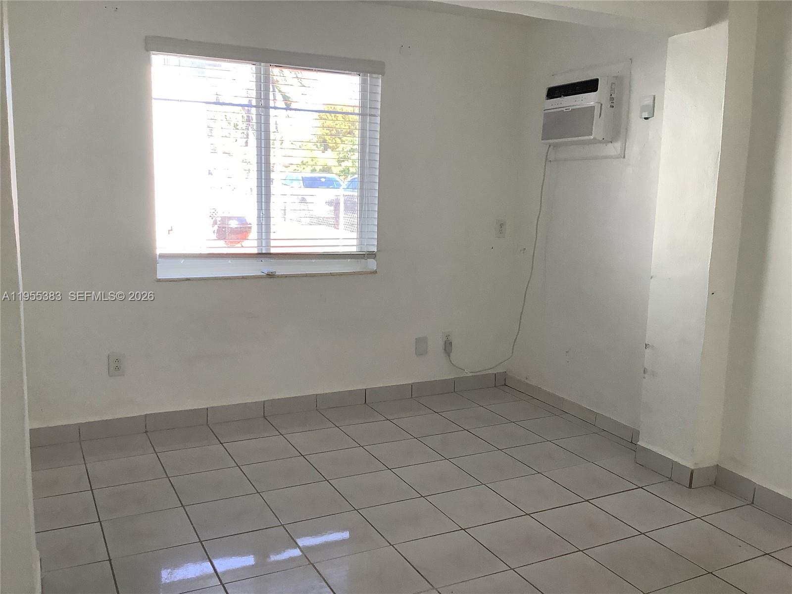 3620 Southwest 13th Terrace, Unit 3 Miami, FL 33145 - Photo 4 of 8 an empty room with windows