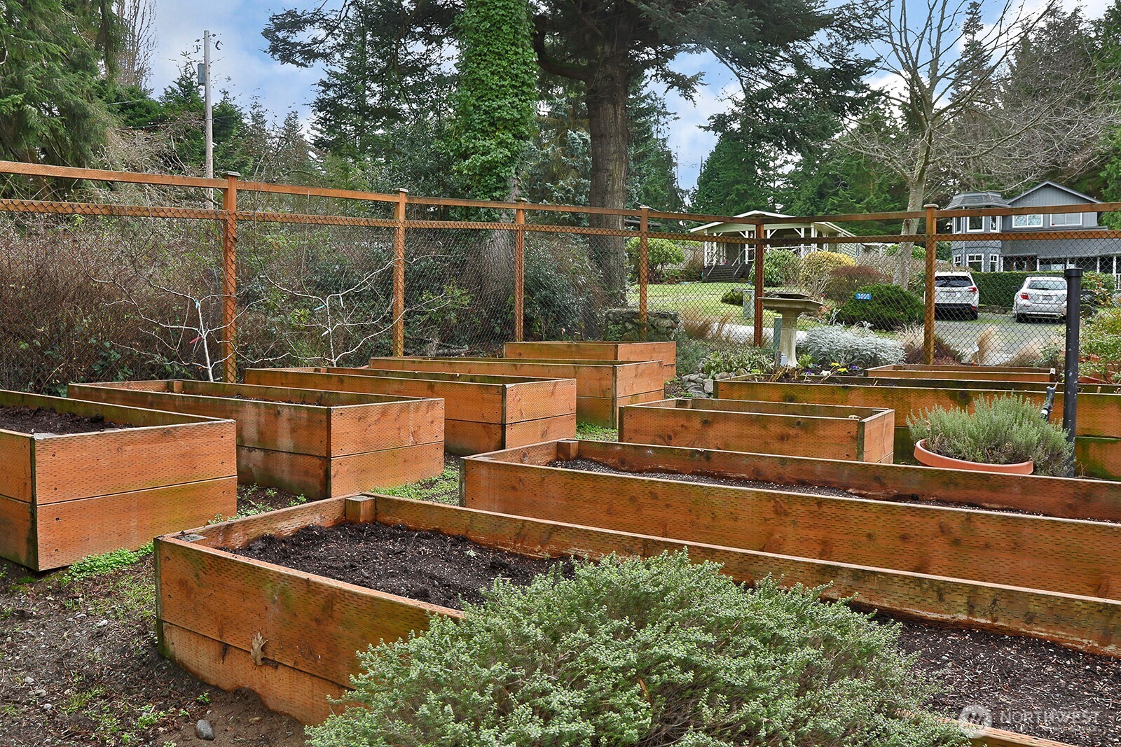 2999 Saratoga Road Langley, WA 98260 - Photo 32 of 40 a view of a yard with chairs and wooden fence