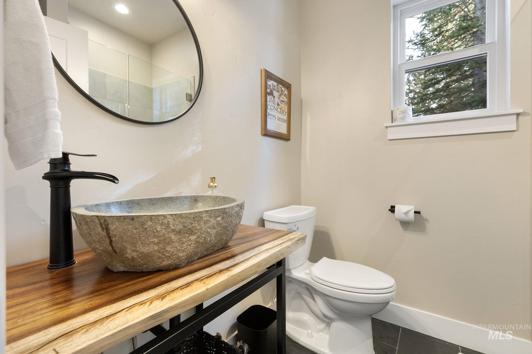 127 Jacks Loop Donnelly, ID 83615 - Photo 19 of 46 Half bathroom featuring vanity and tile patterned flooring