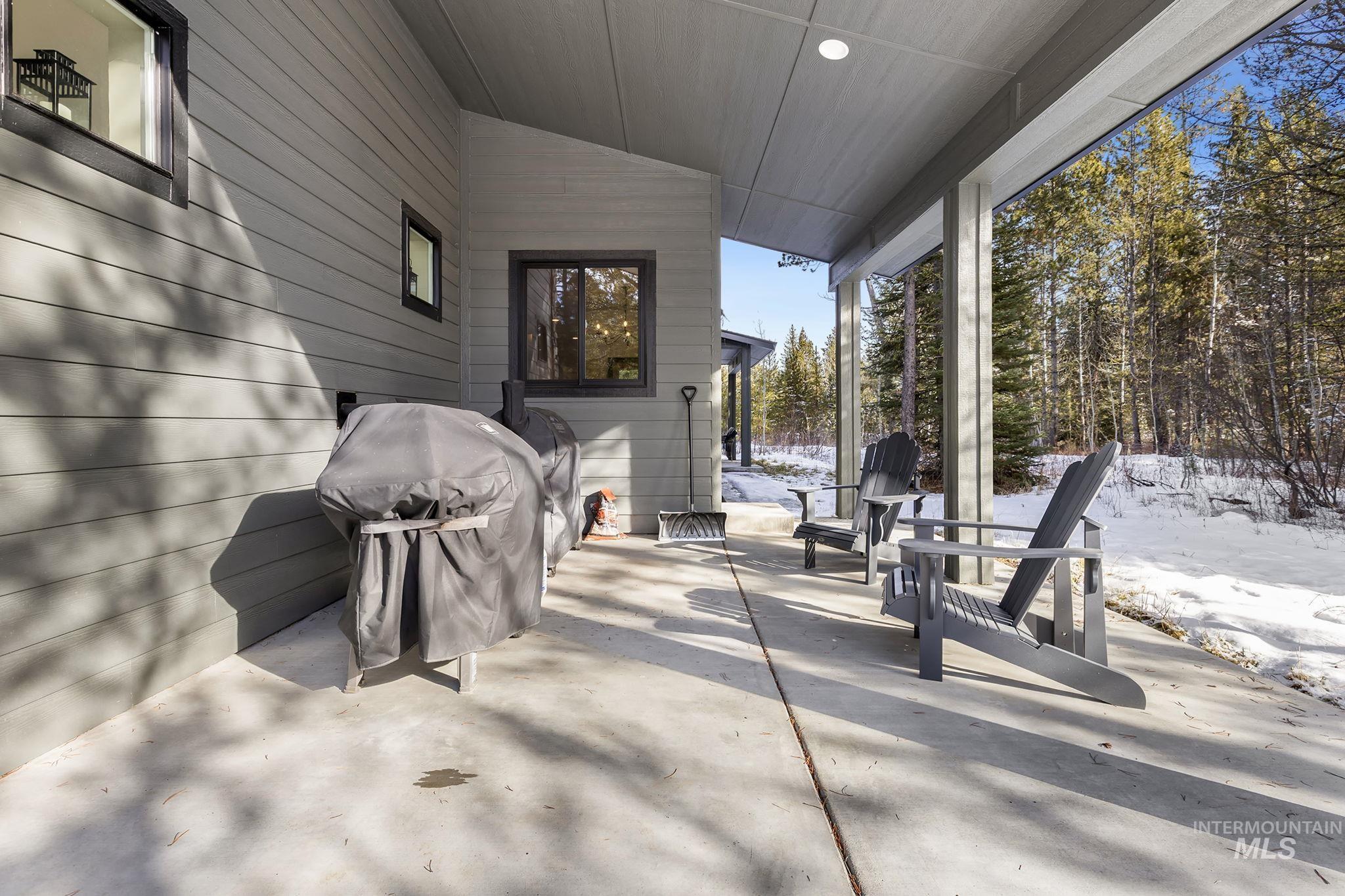 127 Jacks Loop Donnelly, ID 83615 - Photo 33 of 46 Snow covered patio featuring a patio area and grilling area