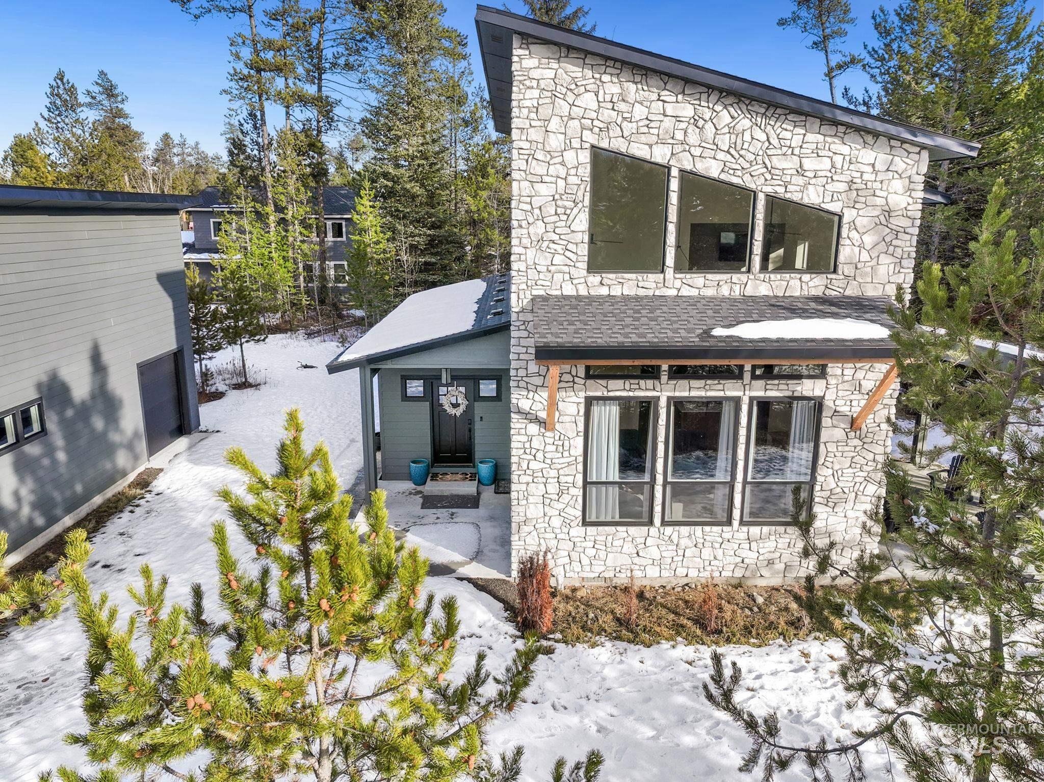 127 Jacks Loop Donnelly, ID 83615 - Photo 38 of 46 Rear view of house with stone siding