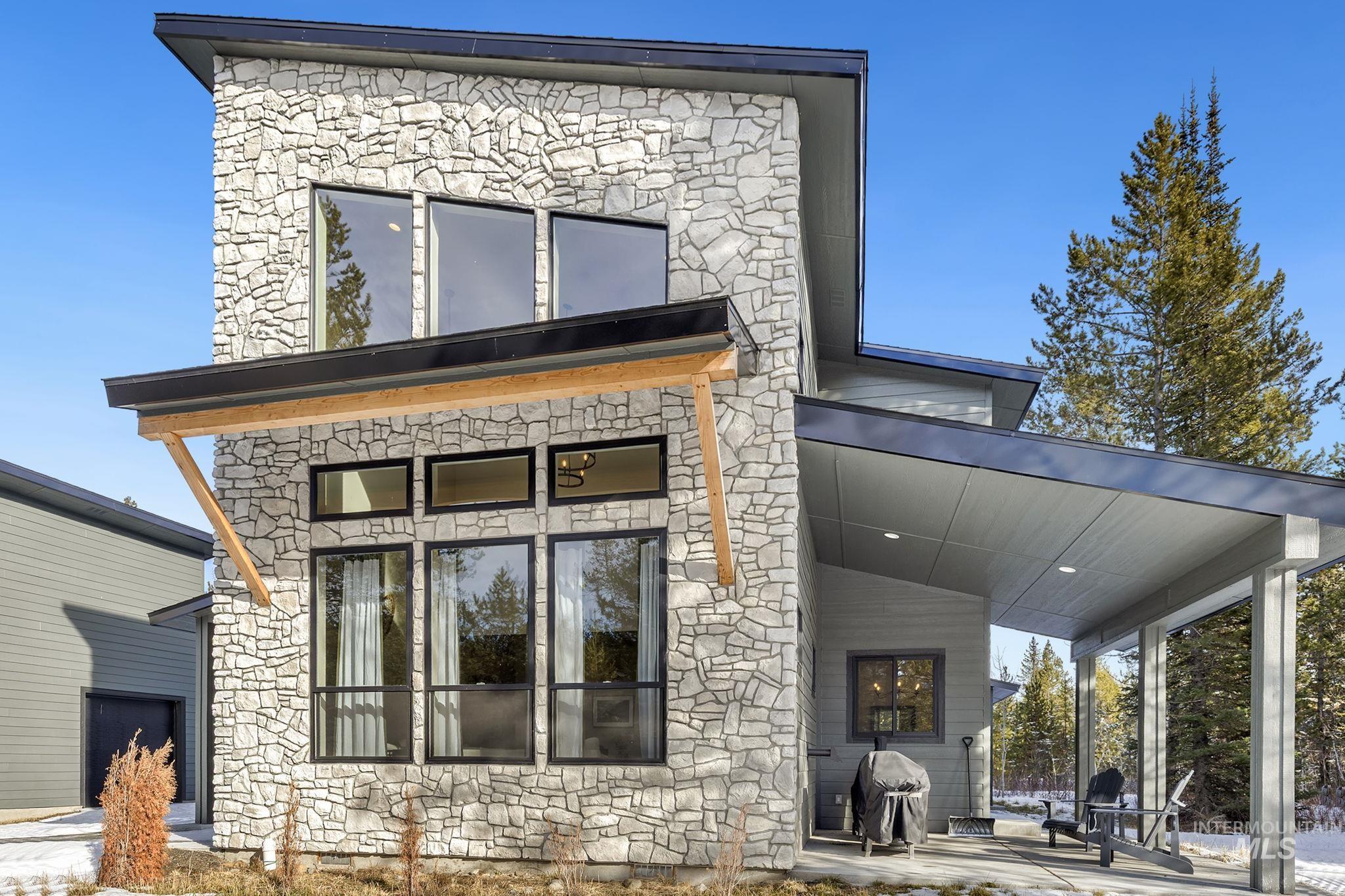 127 Jacks Loop Donnelly, ID 83615 - Photo 4 of 46 Rear view of property featuring stone siding