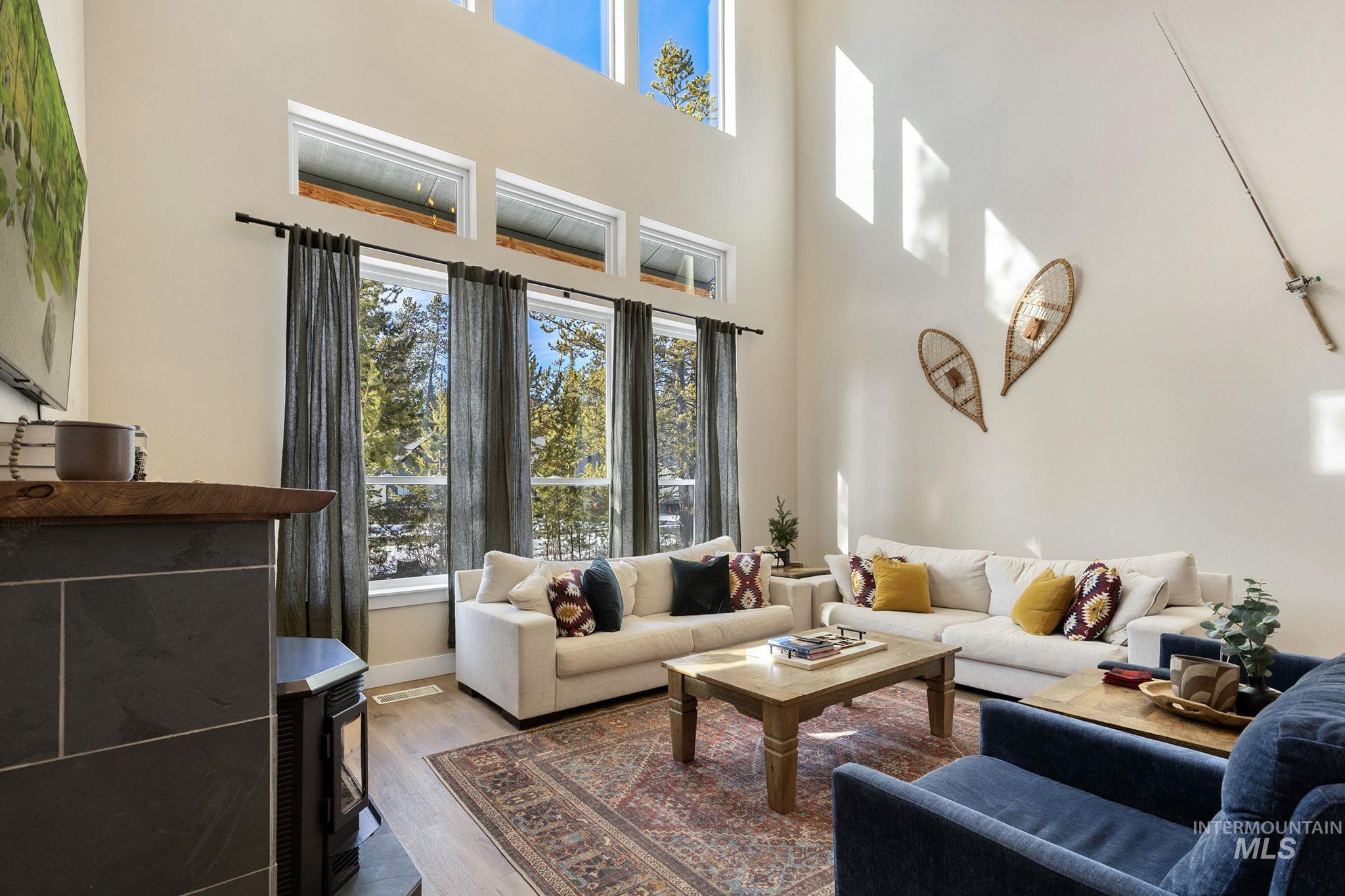 127 Jacks Loop Donnelly, ID 83615 - Photo 8 of 46 Living area featuring wood finished floors and a high ceiling