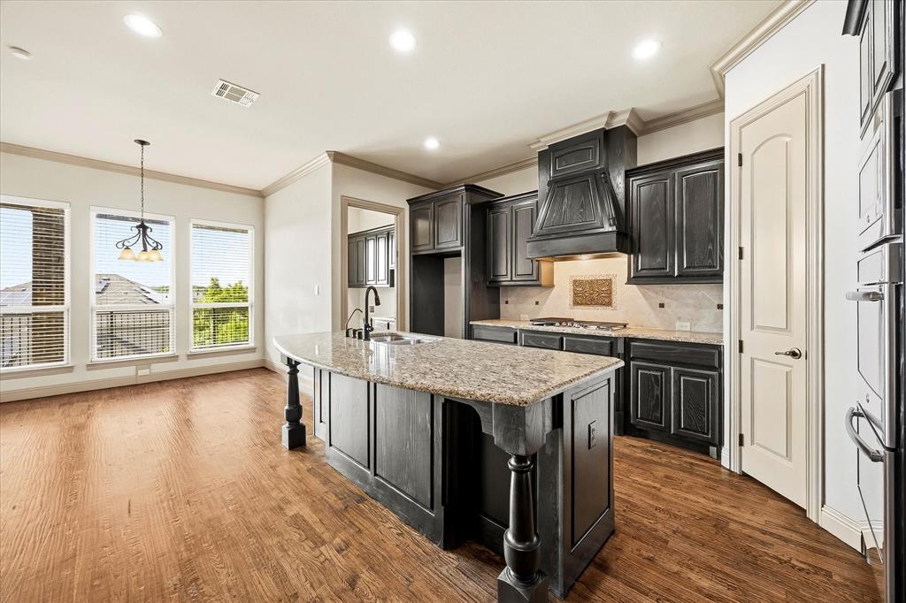 647 Gillon Way Rockwall, TX 75087 - Photo 15 of 40 Center island-breakfast bar is one of this kitchen's many amenities!