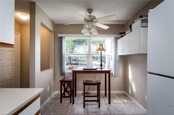 a view of a dining room with furniture window and outside view