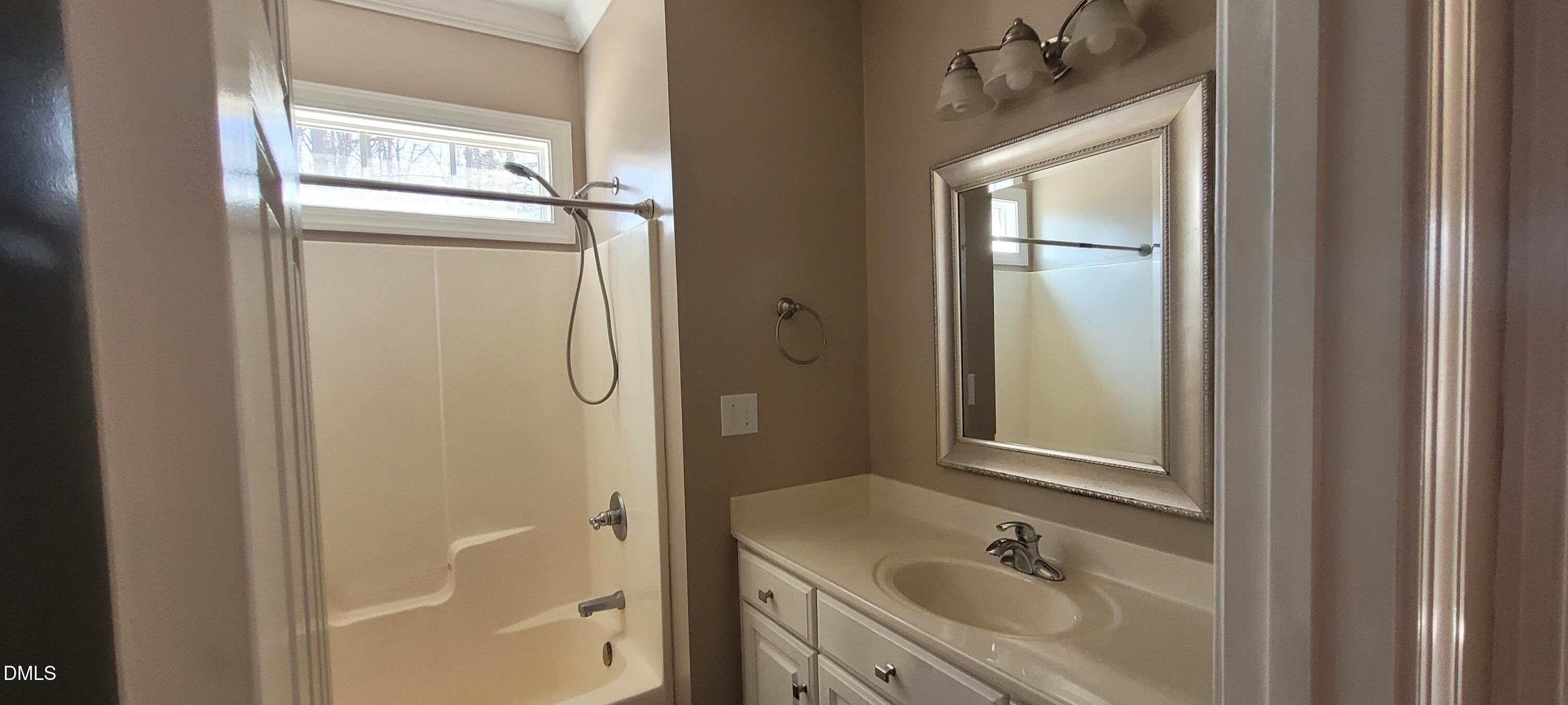 226 Fletcher Ridge Road Timberlake, NC 27583 - Photo 17 of 30 a bathroom with a granite countertop sink toilet and shower