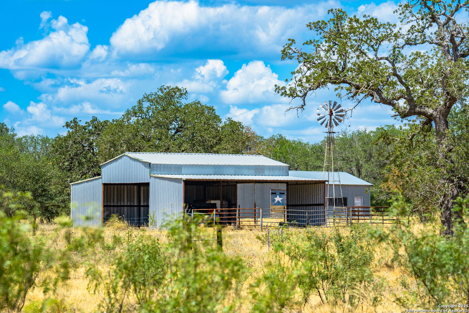 1700 Bruce Road Poteet, TX 78065 - Photo 26 of 46 a front view of a house with a yard and garage