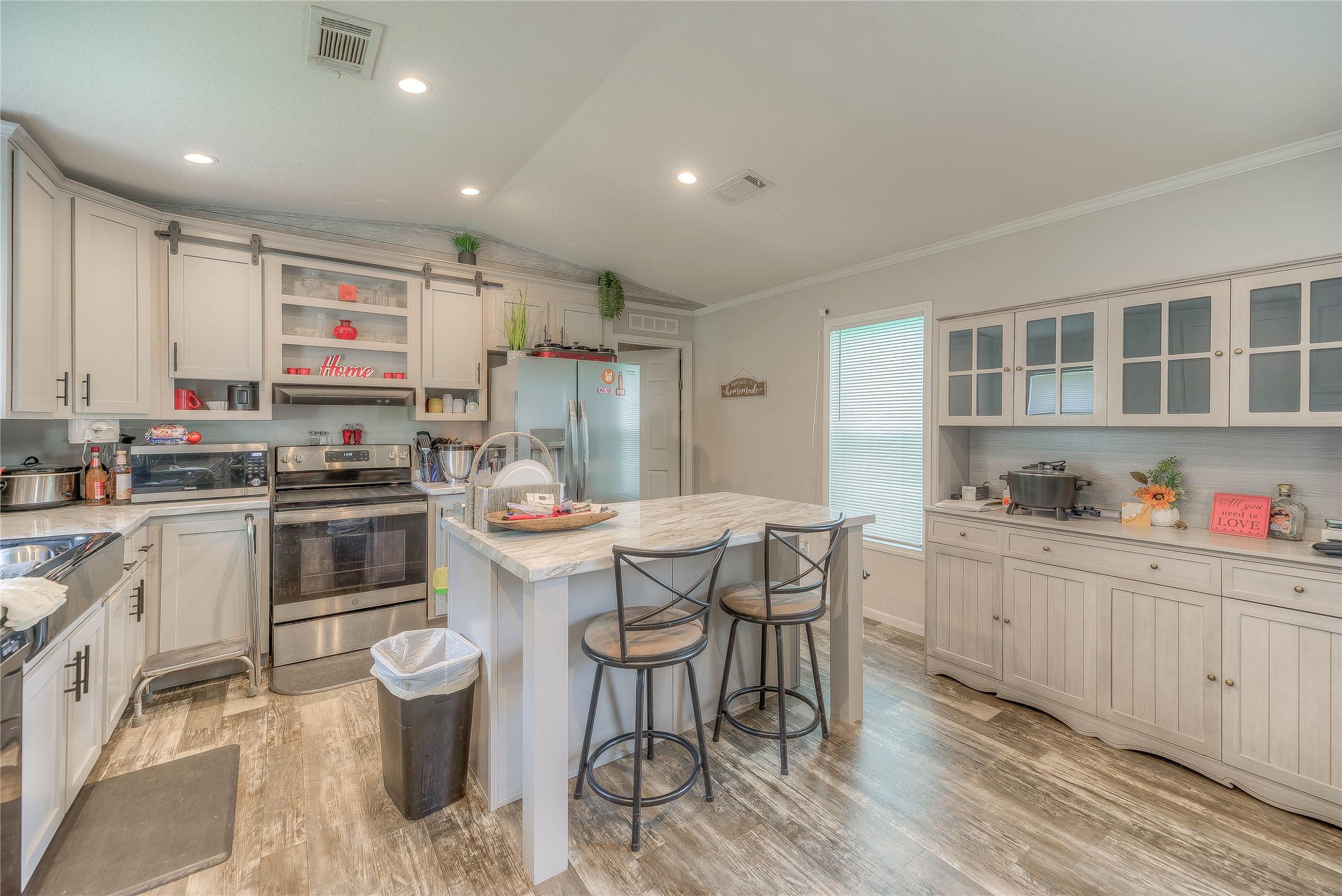 363 Deer Run Road Trinity, TX 75862 - Photo 14 of 28 a kitchen that has a lot of cabinets in it and appliances