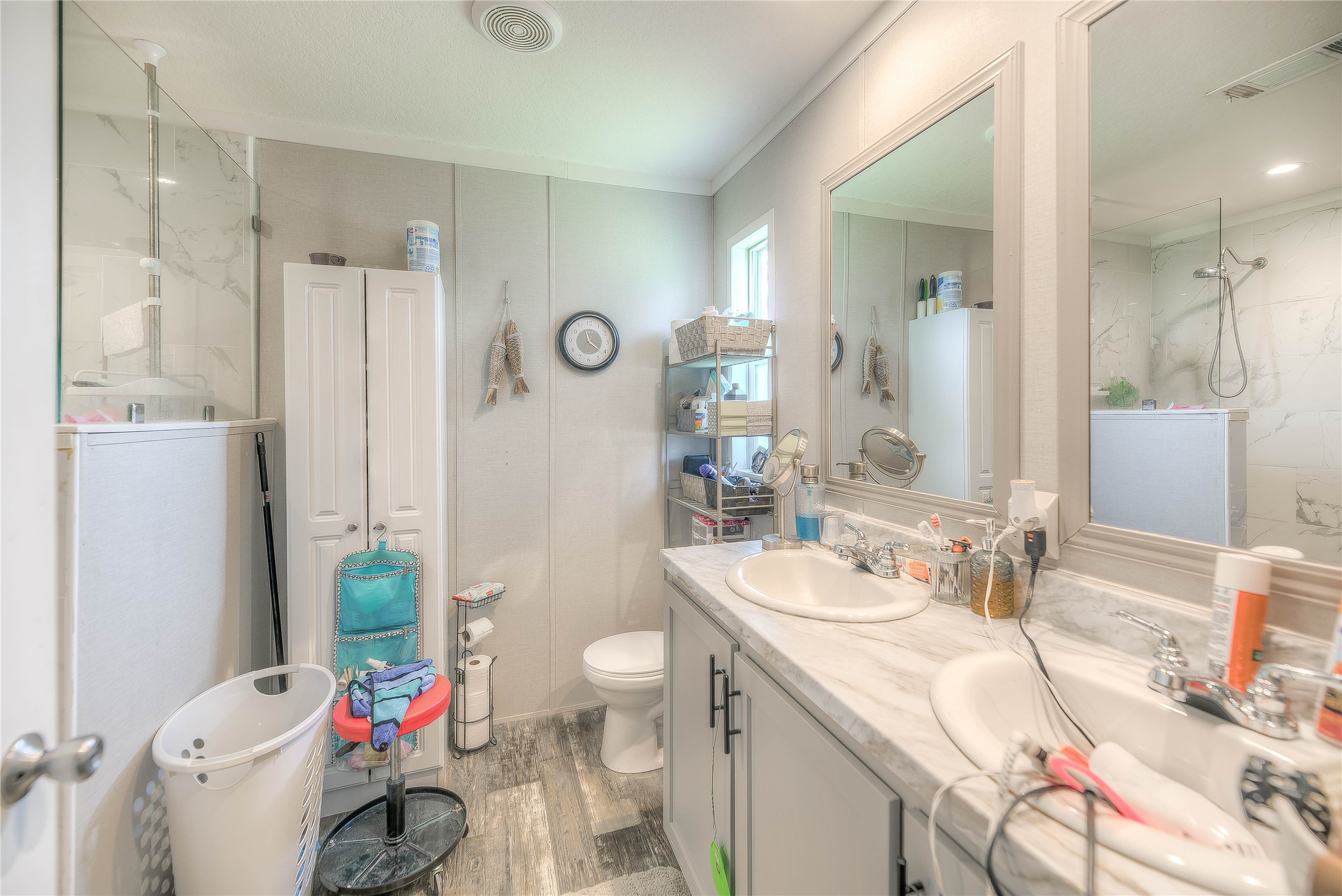 363 Deer Run Road Trinity, TX 75862 - Photo 18 of 28 a bathroom with a sink a toilet and shower