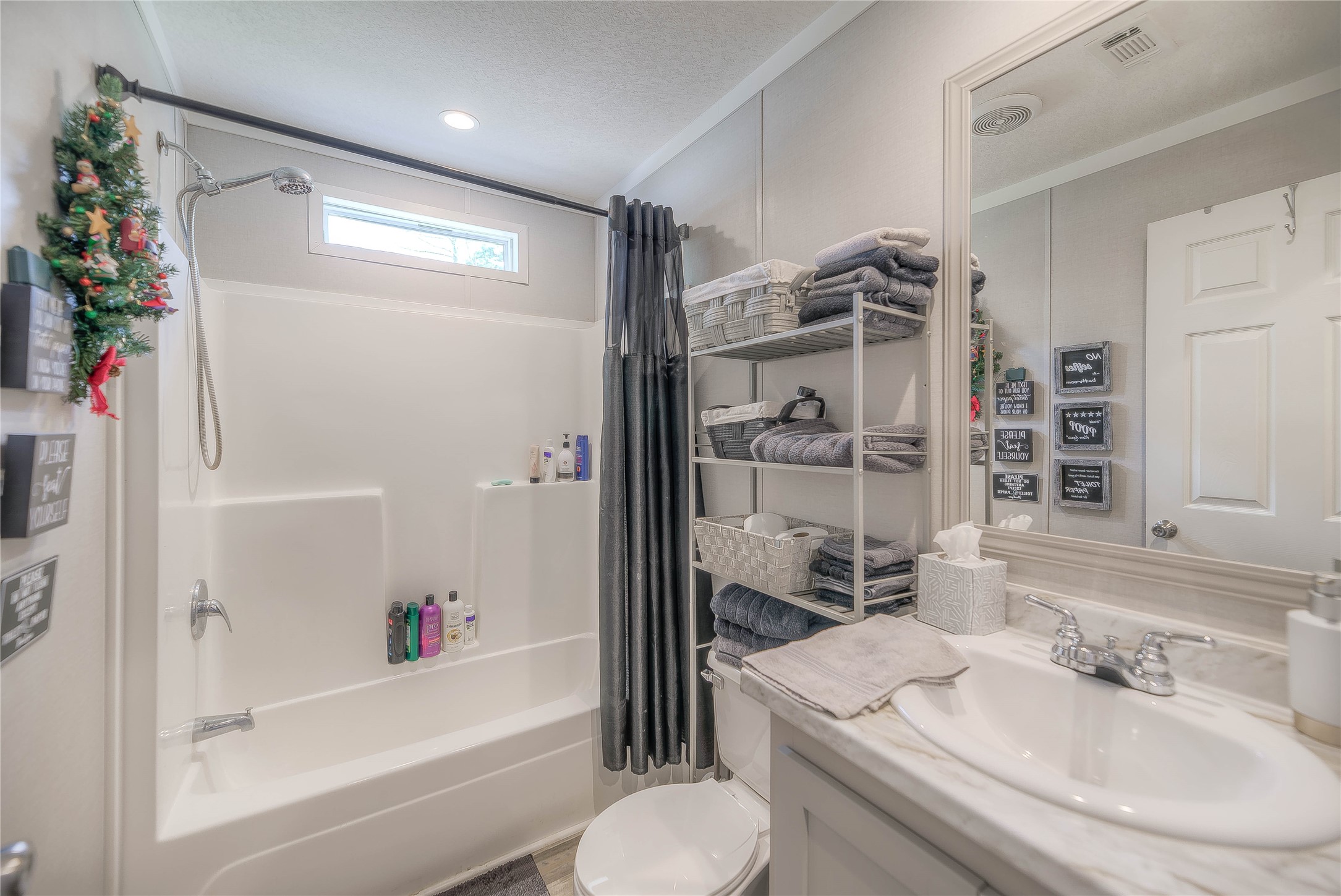 363 Deer Run Road Trinity, TX 75862 - Photo 20 of 28 a bathroom with a sink toilet and shower