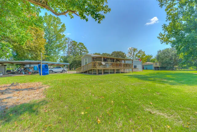a view of a house with a big yard