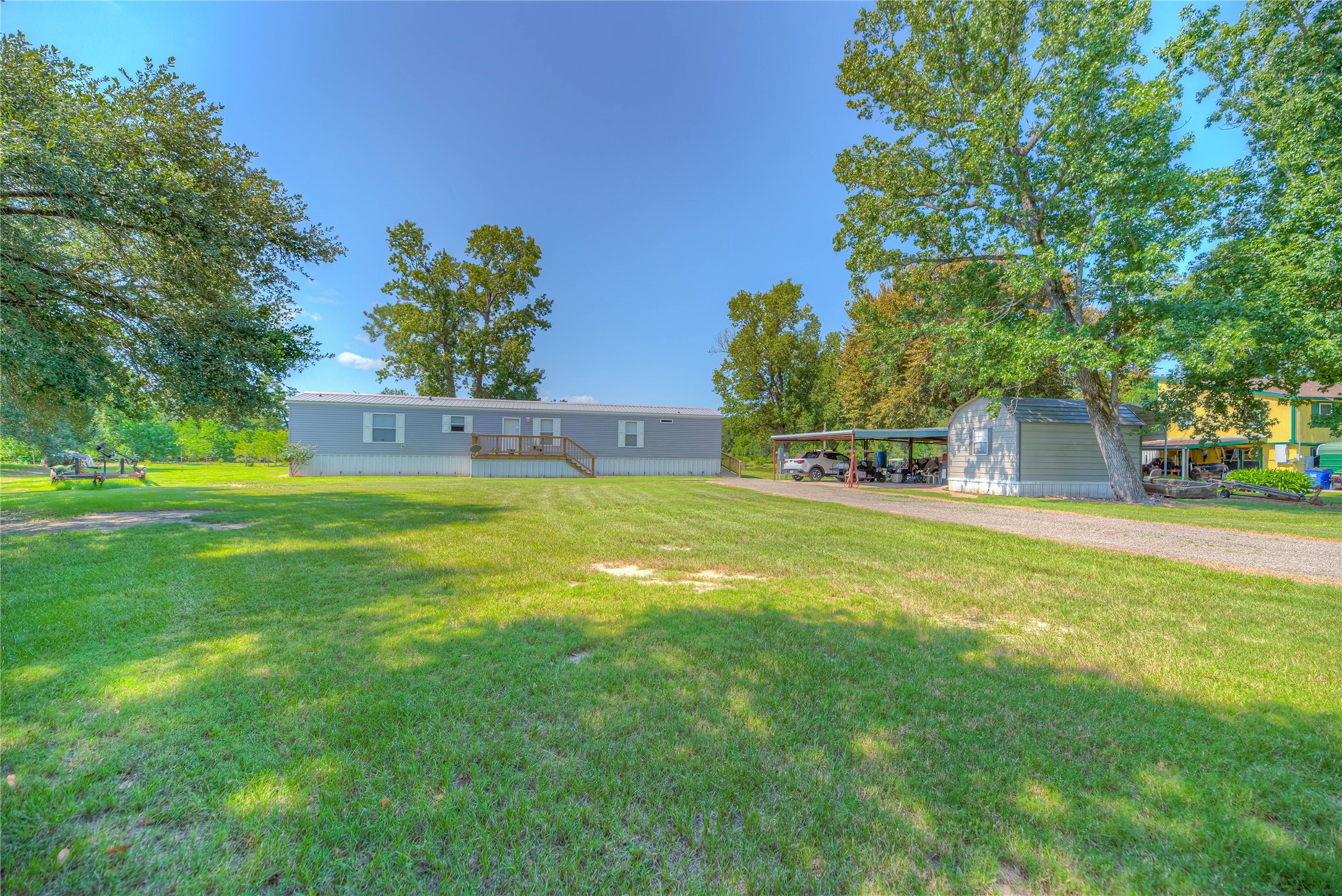 363 Deer Run Road Trinity, TX 75862 - Photo 26 of 28 a view of a house with a yard