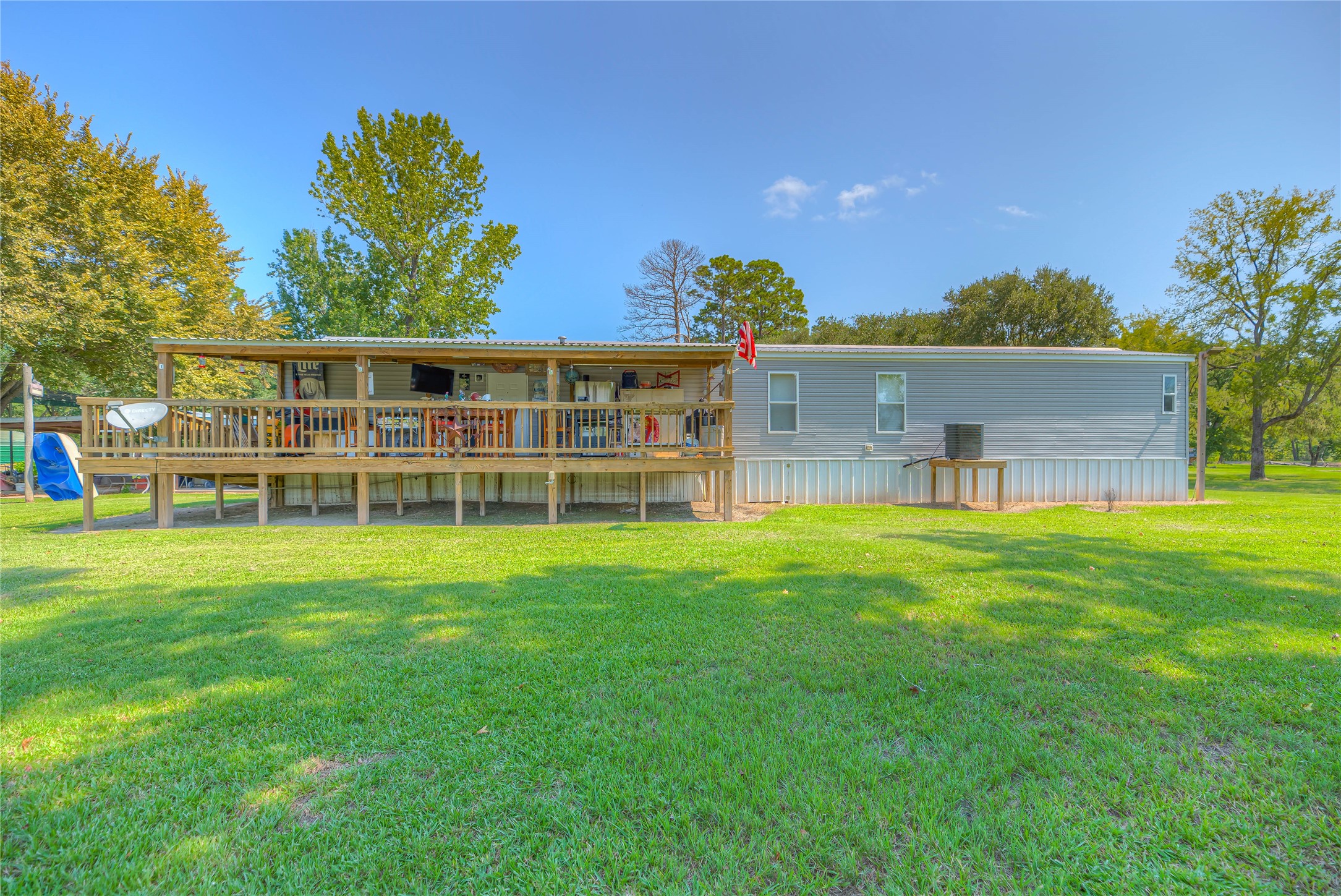363 Deer Run Road Trinity, TX 75862 - Photo 27 of 28 a front view of a house with a yard