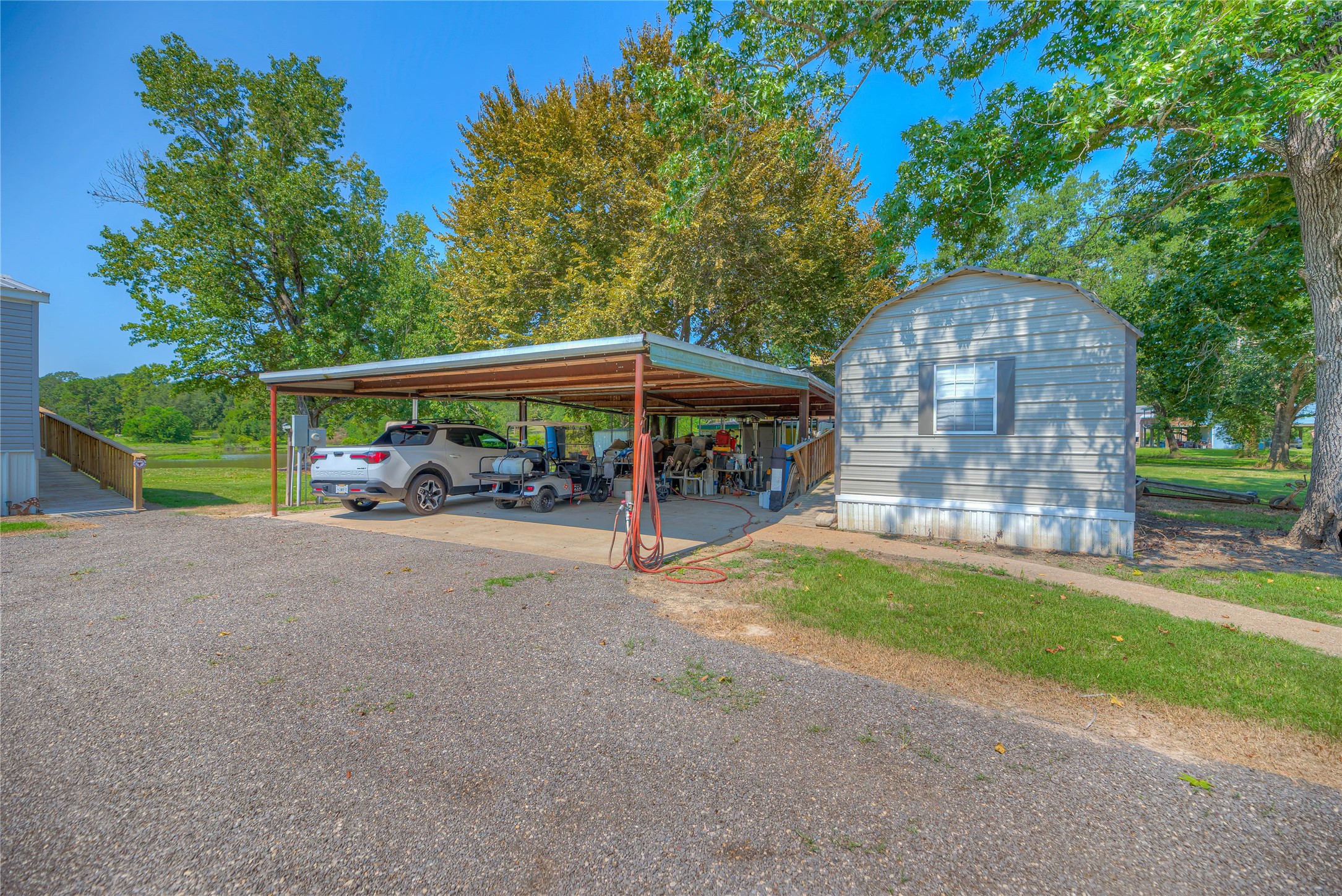 363 Deer Run Road Trinity, TX 75862 - Photo 5 of 28 a view of a street with a car parked beside of it