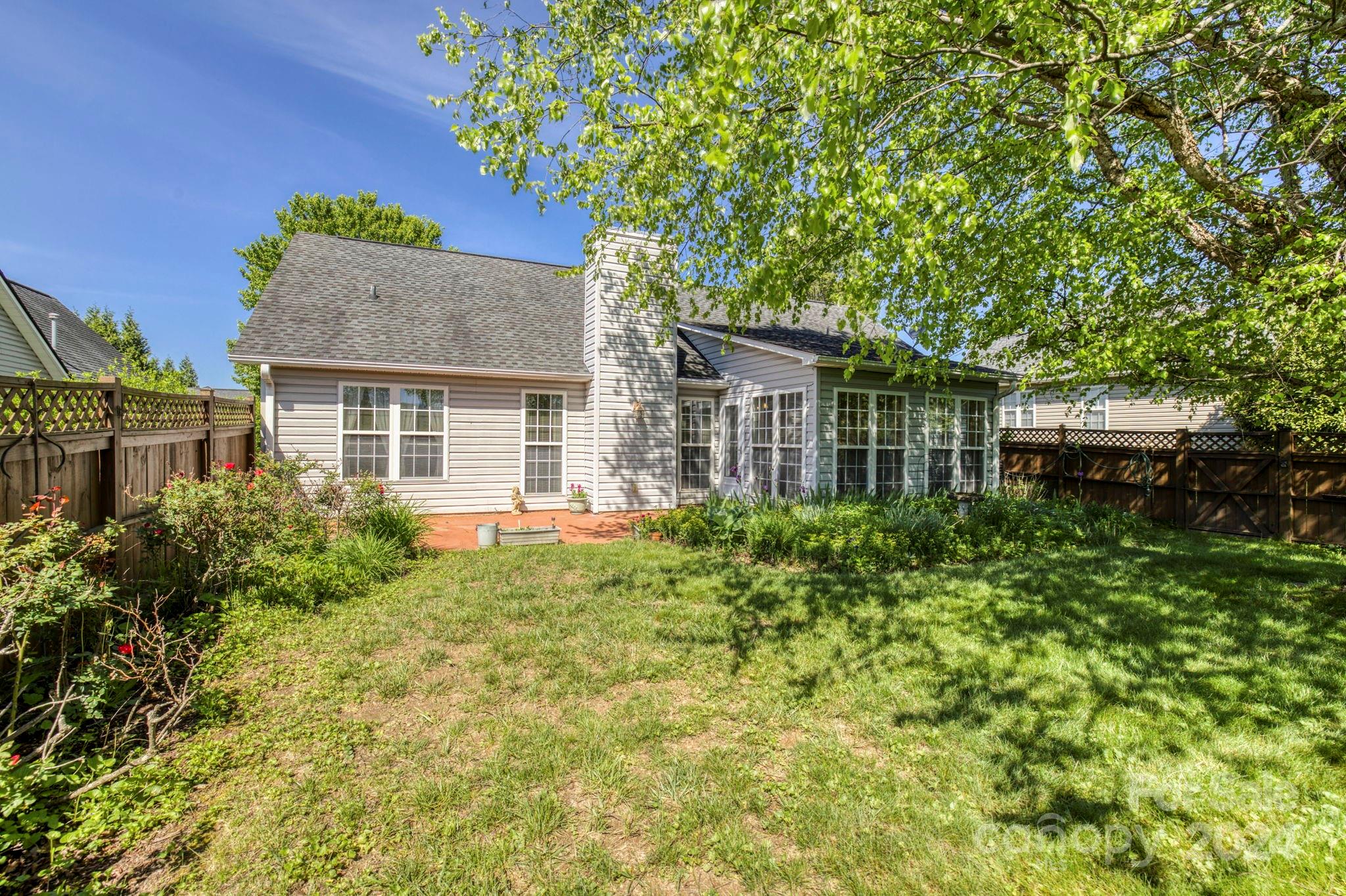 93 Farm Valley Road Fletcher, NC 28732 - Photo 6 of 36 front view of a house with a garden