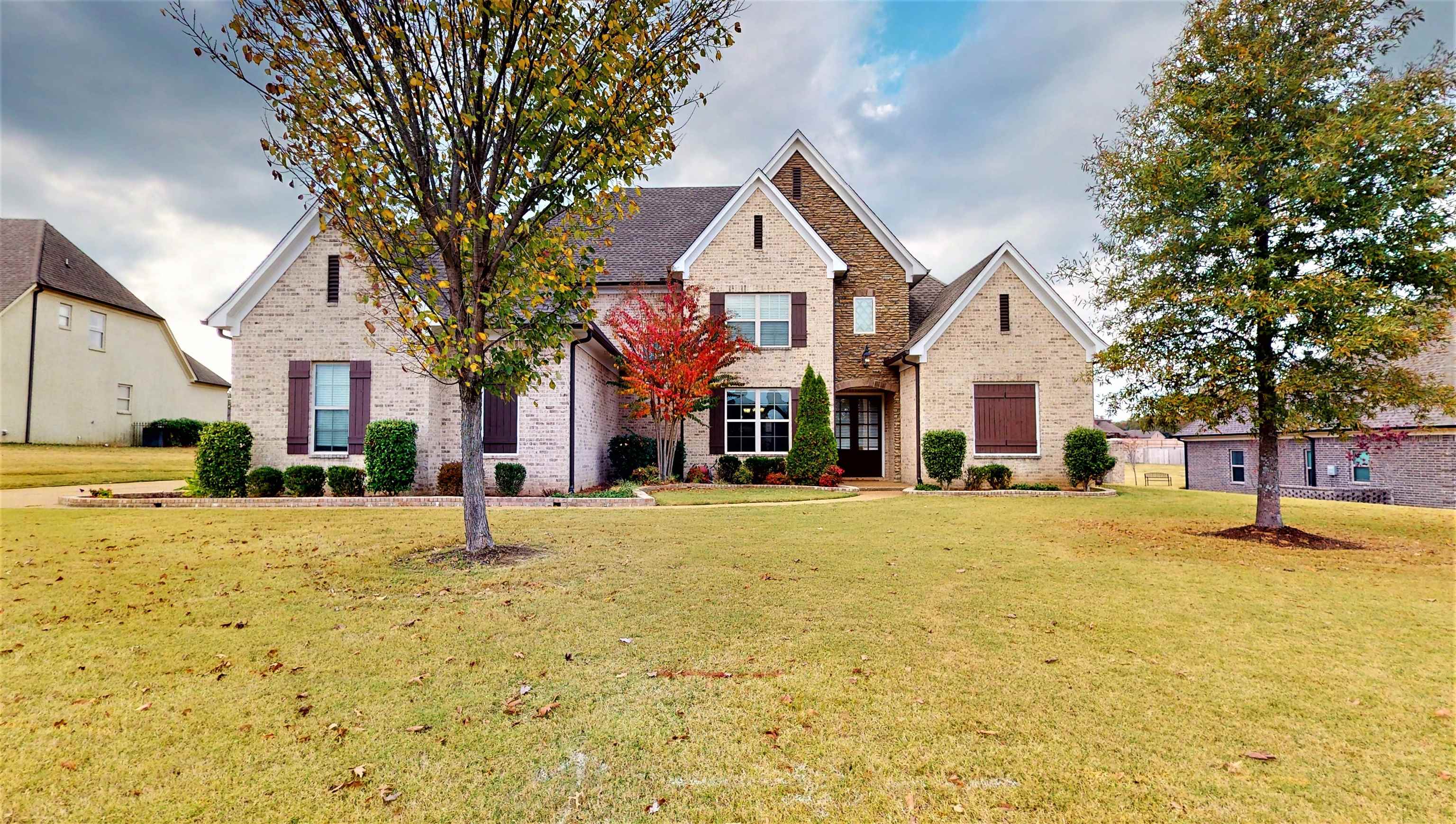4339 Whisper Trail Drive Olive Branch, MS 38654 - Photo 1 of 25 a view of a house with a yard and garage