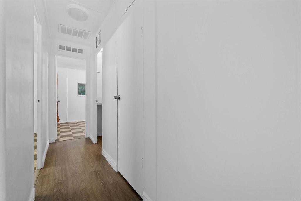 12044 Royal Road, Unit 93 El Cajon, CA 92021 - Photo 20 of 29 a view of a hallway with a wooden floor